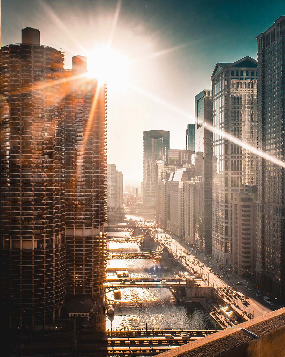 high rise sun raise over the building town